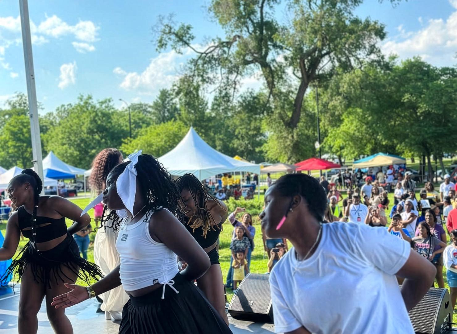 Young black grisl dancing at community event